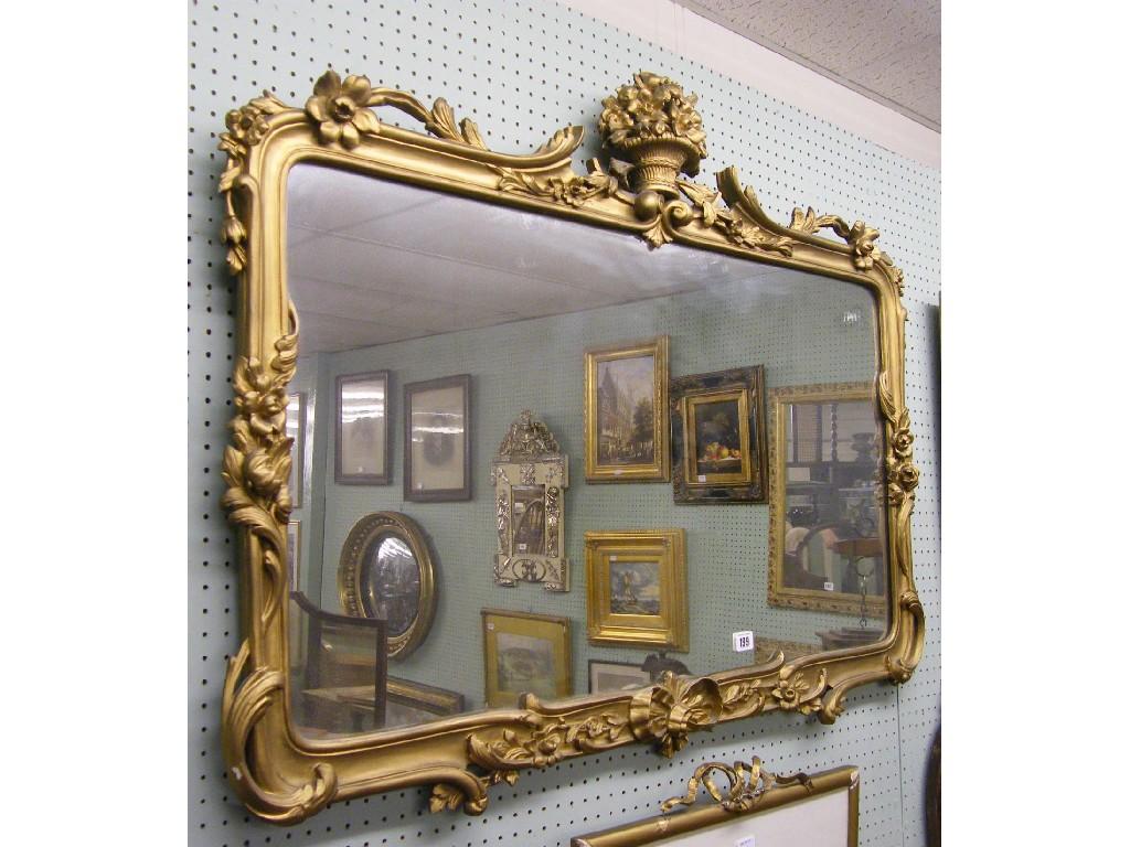 Appraisal: Giltwood Rococo style wall mirror the foliate carved frame surmounted