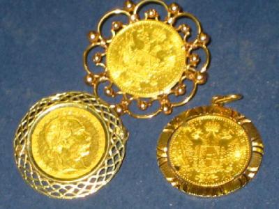 Appraisal: THREE AUSTRIAN GOLD FRANC COINS dated two in brooch mounts