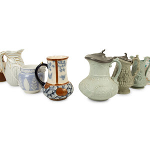 Appraisal: A Collection of Eight English Salt Glazed Relief Form Pitchers