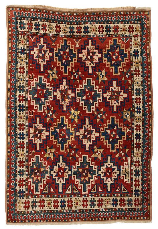 Appraisal: Kazak Rug circa red field with stepped and hooked devices