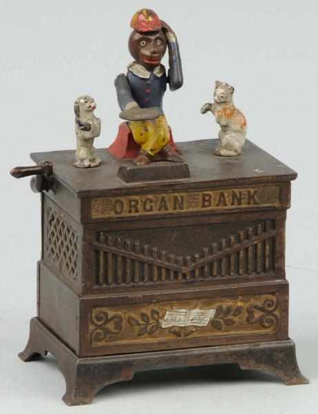 Appraisal: Cast Iron Organ Grinder Cat Dog Mechanical Bank Description Manufactured