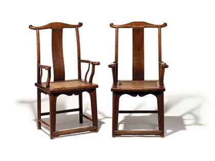 Appraisal: Pair of Chinese yumu yoke-back chairs th century The protruding