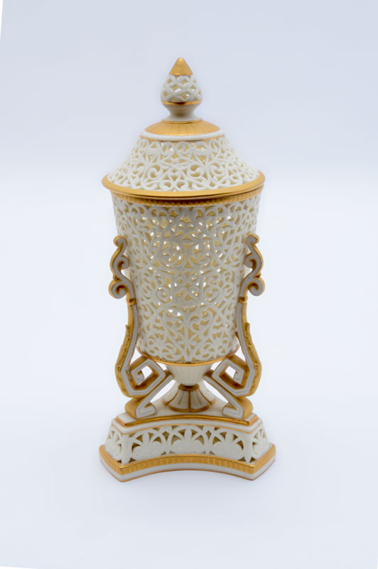 Appraisal: GRANGER CO RETICULATED COVERED PORCELAIN URN Pierced ivory ground body