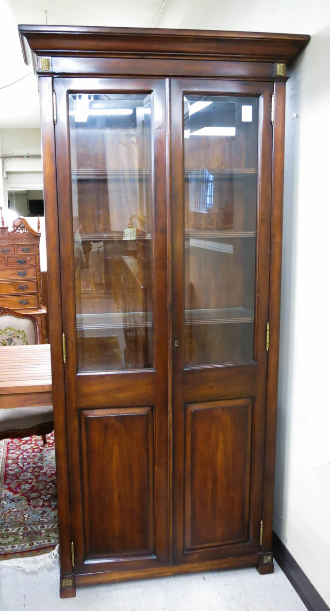 Appraisal: TALL DOUBLE-DOOR DISPLAY CABINET having five interior illuminated shelves behind