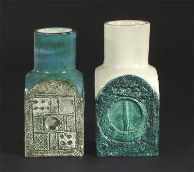 Appraisal: Two Troika Pottery Chimney vases modelled in low relief painted