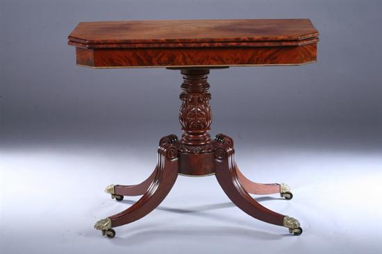 Appraisal: EMPIRE MAHOGANY FLIP-TOP PEDESTAL CONSOLE TABLE th century With gilt-metal