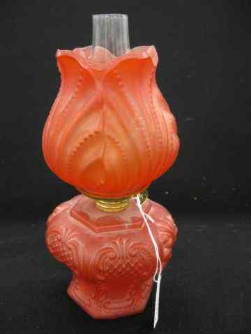 Appraisal: Victorian Ruby Satin Glass Miniature Oil Lamp matching shade acorn