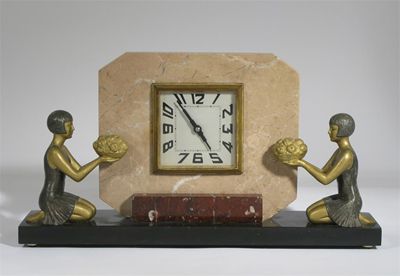 Appraisal: A patinated metal and marble clock the octagonal clock face