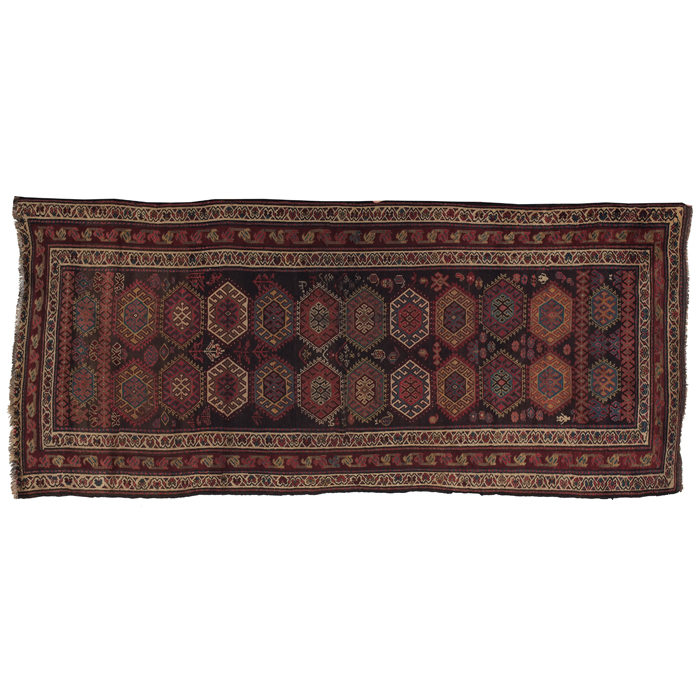 Appraisal: Caucasian rug c stylized floral design on a brown field