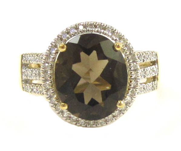 Appraisal: SMOKY QUARTZ AND TEN KARAT GOLD RING with round-cut diamonds