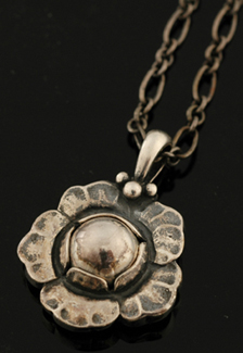 Appraisal: A silver pendant and chain by Georg Jensen The sterling