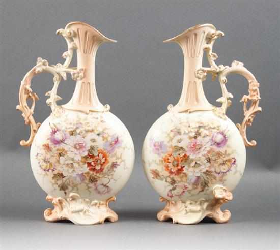 Appraisal: Pair of German floral decorated porcelain ewers late th century