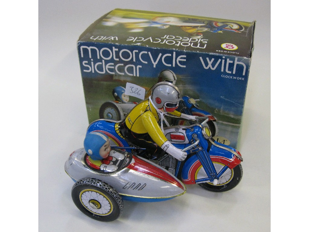 Appraisal: Tinplate clockwork toy motorcycle with sidecar