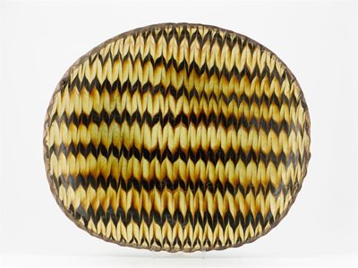 Appraisal: A large oval slipware dish with a pinched rim the