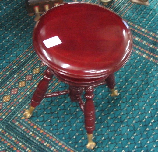 Appraisal: A MAHOGANY PIANO STOOL American c having an adjustable revolving