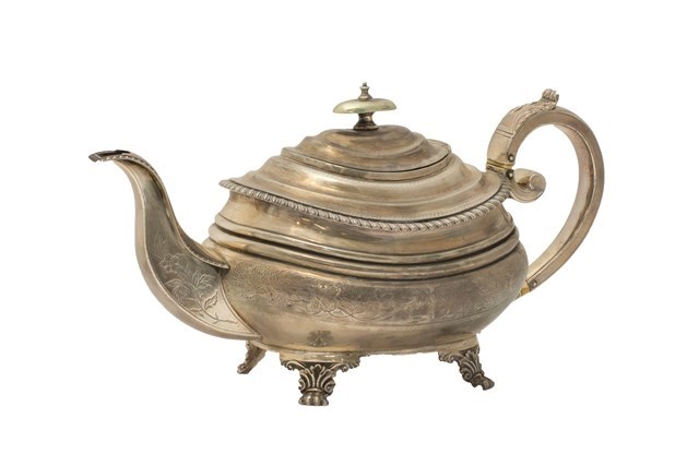 Appraisal: A George III silver teapot of boat shaped form engraved