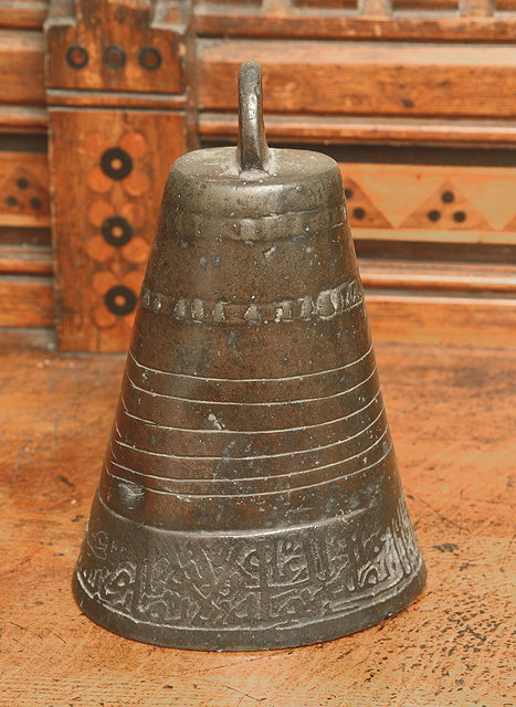 Appraisal: AN ANTIQUE BRONZE MIDDLE EASTERN BELL with loop suspension and