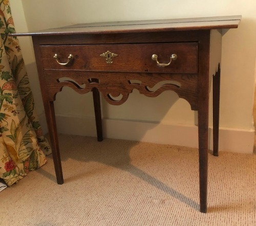 Appraisal: A George III oak lowboy with over hanging rectangular two