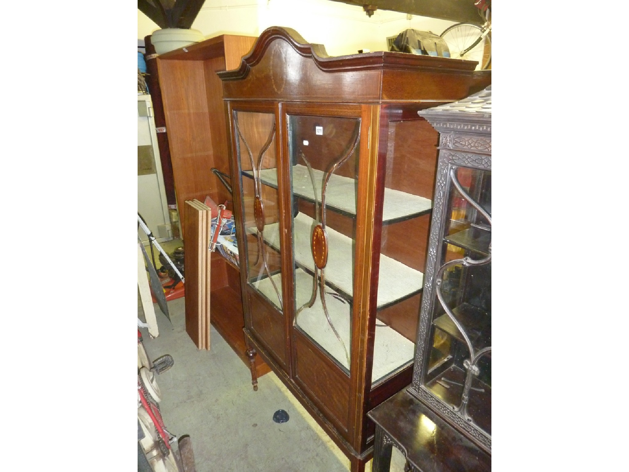 Appraisal: An inlaid Edwardian mahogany display cabinet with three quarter length