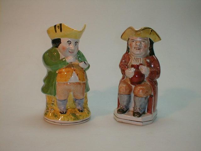 Appraisal: A thC Staffordshire Toby jug polychrome painted modelled as a