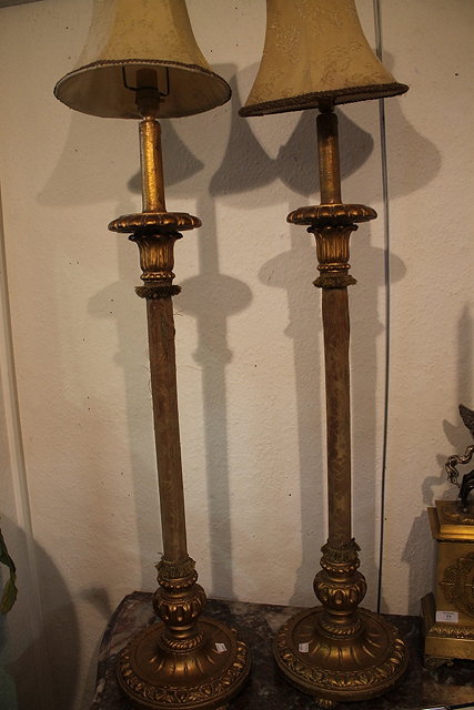 Appraisal: A PAIR OF ITALIANATE GILT LAMPS with fabric covers to