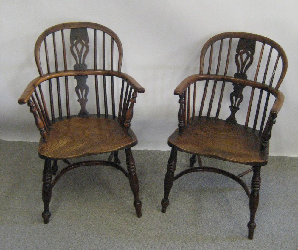 Appraisal: A PAIR OF VICTORIAN YEW WINDSOR ARMCHAIRS of low double