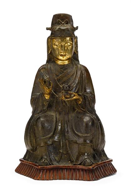 Appraisal: Chinese gilt bronze partially gilt bronze Quanyin figure on wood