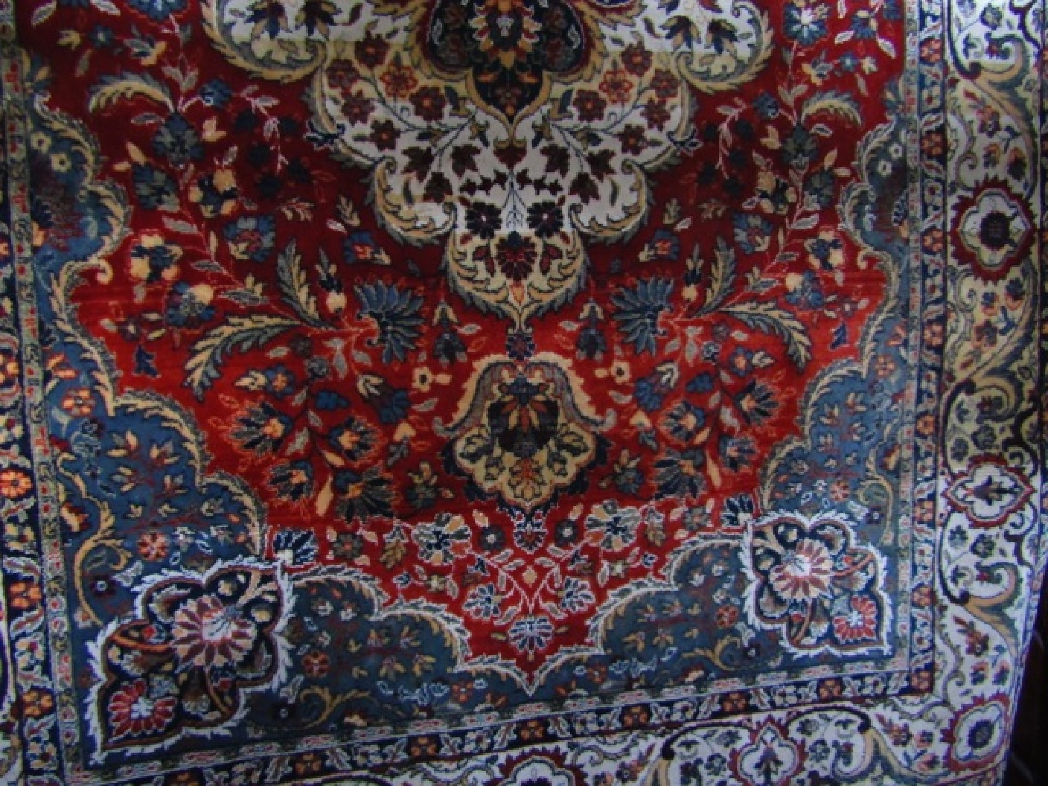 Appraisal: An eastern wool work rug the central red field interspersed