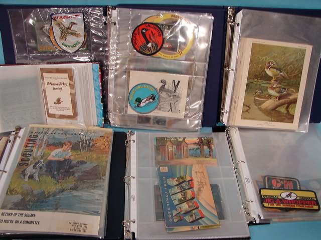 Appraisal: notebooks including stamps patches photos pins postcards and books