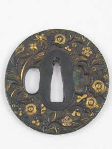 Appraisal: A cast iron tsuba with gilt flora