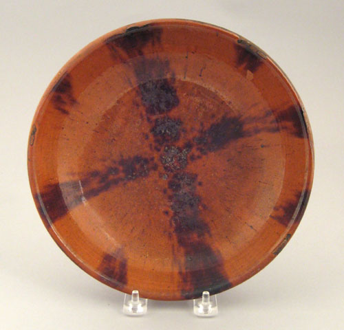 Appraisal: Redware shallow bowl th c with manganese cross decoration dia