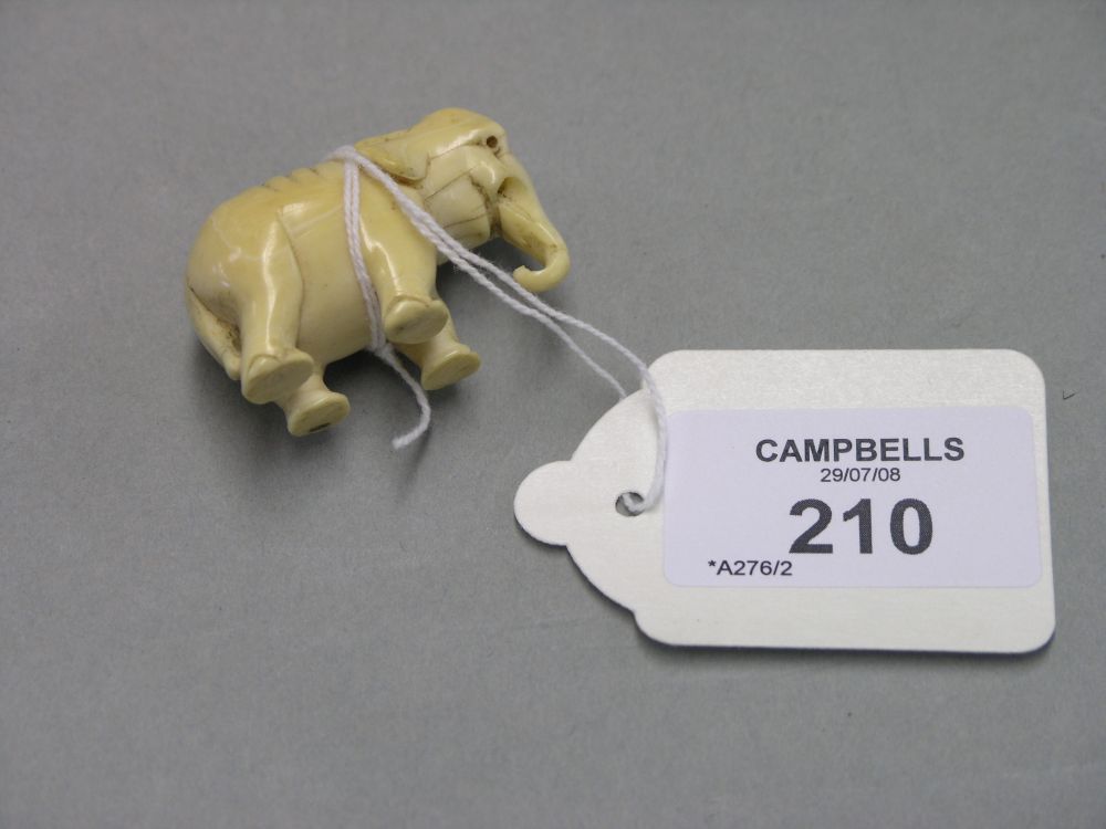 Appraisal: A small carved ivory model of an elephant in -