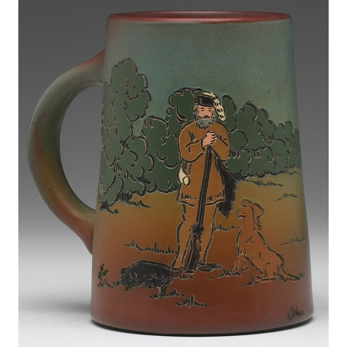 Appraisal: Weller Dickensware handled vessel incised and painted frontiersman with gun