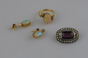 Appraisal: ct yellow gold claw set water opal and diamond cross-over