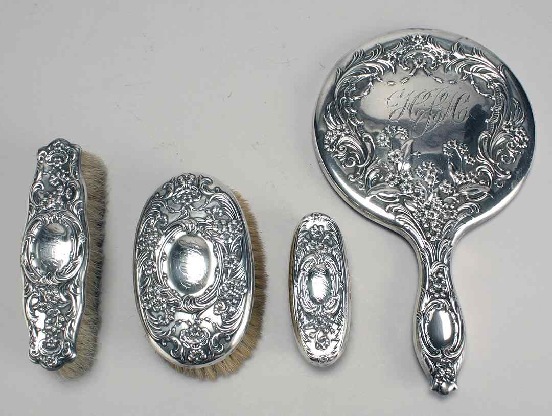 Appraisal: WHITING DIV OF GORHAM FOUR-PIECE STERLING SILVER DRESSER SETIn repouss