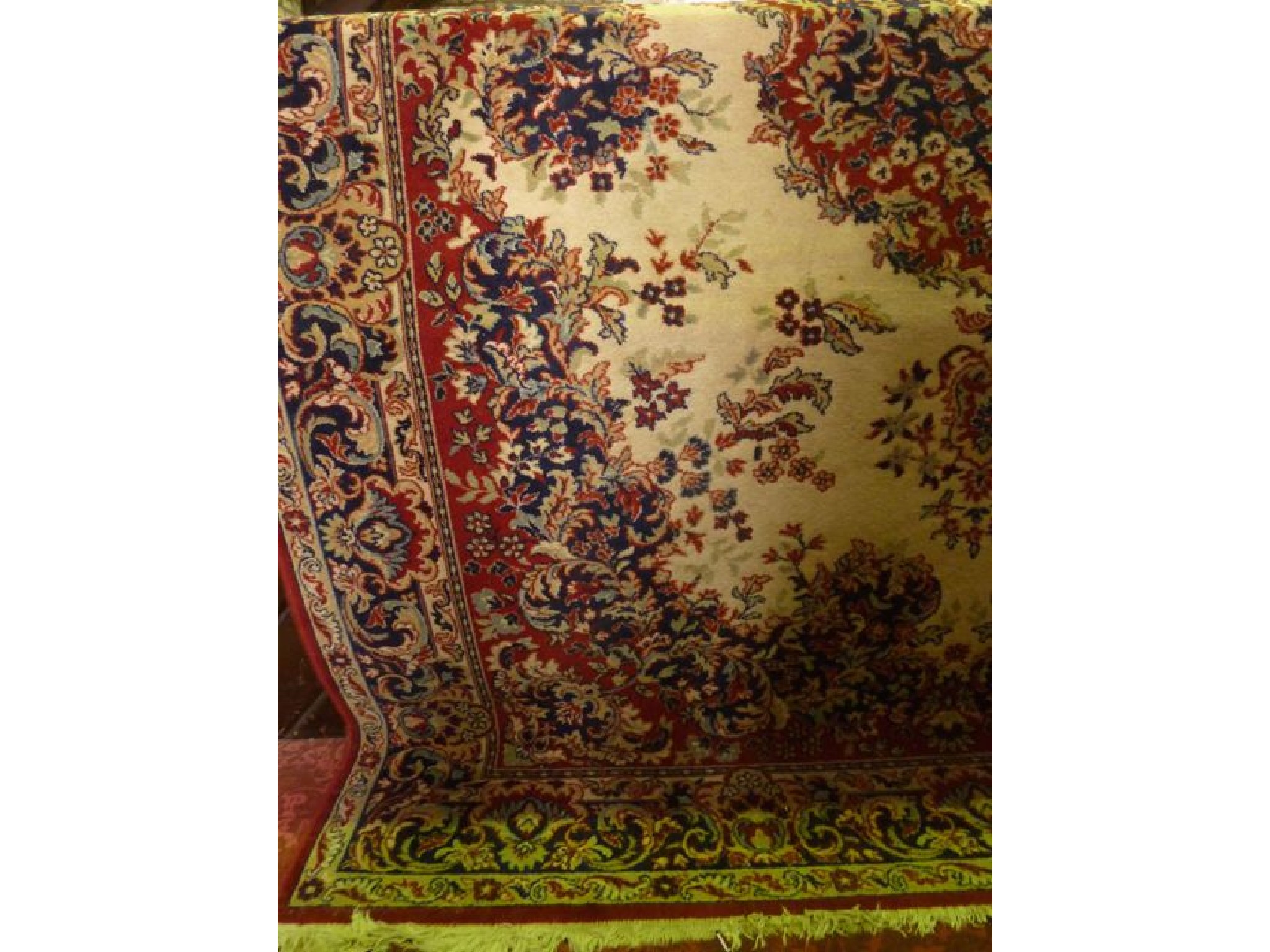 Appraisal: A Persian style wool carpet with white field and further