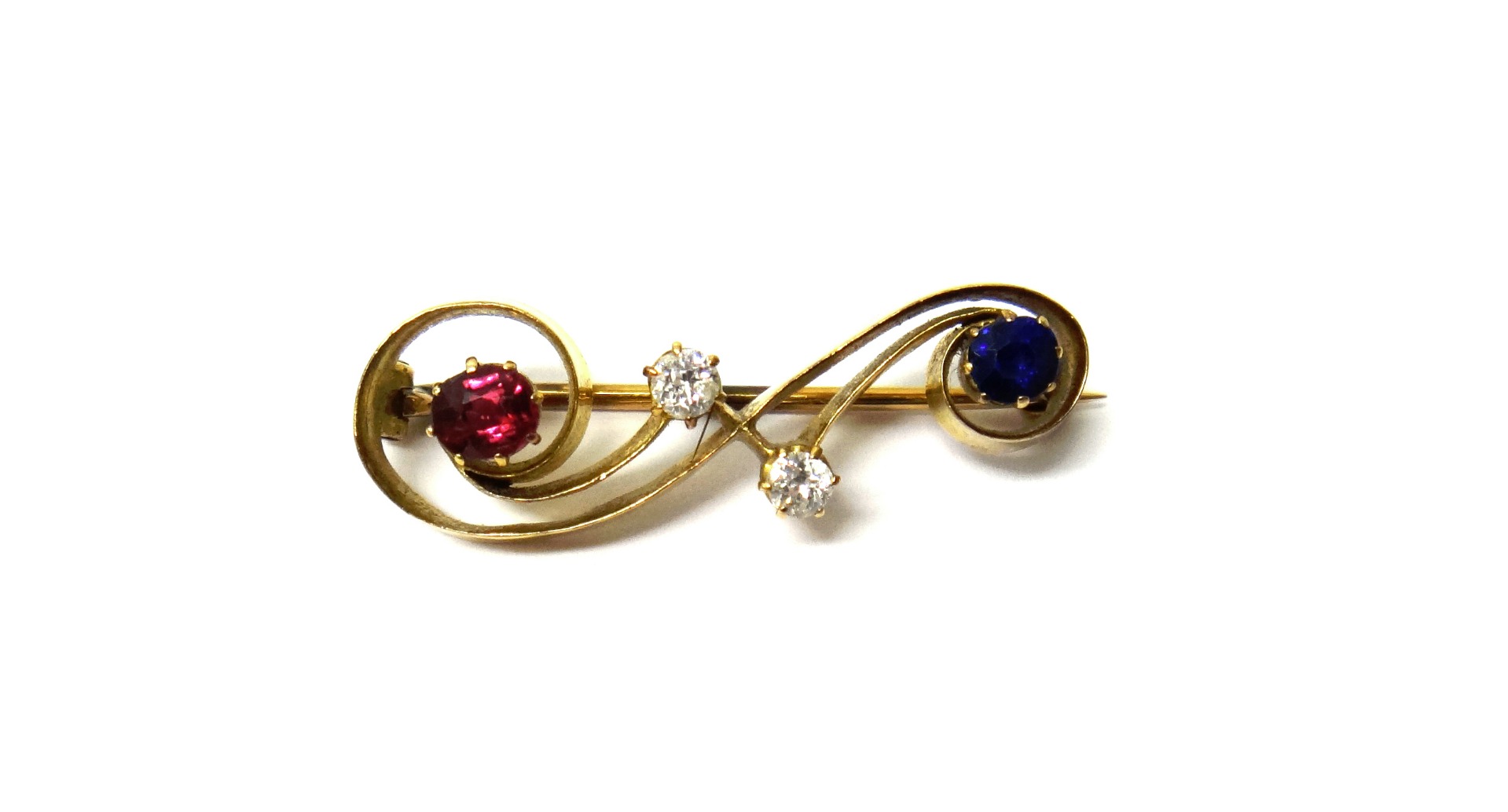 Appraisal: A gold diamond ruby and sapphire set brooch in a