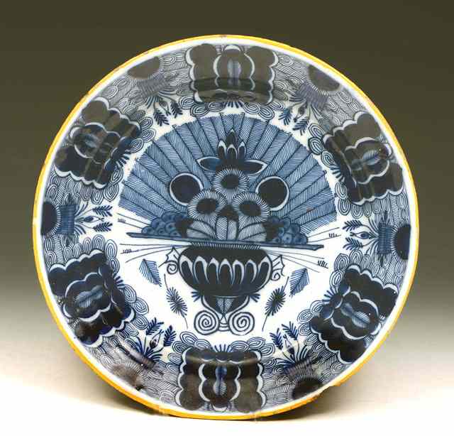 Appraisal: A DUTCH DELFT BLUE AND WHITE DISH decorated a vase