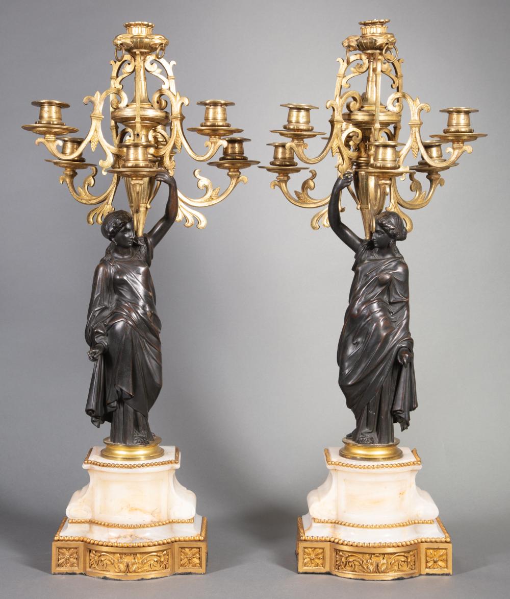 Appraisal: Pair of French Gilt and Patinated Bronze Seven-Light Figural Candelabra