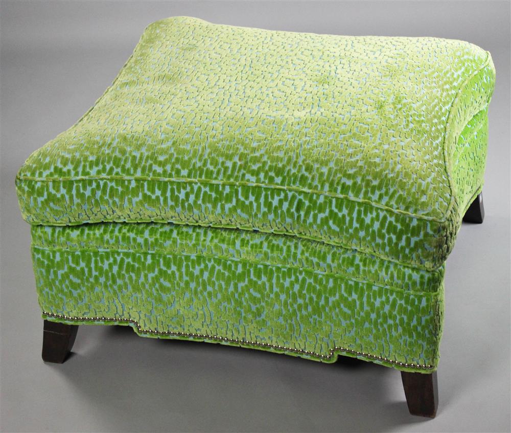 Appraisal: CONTEMPORARY CUT GRASS GREEN VELVET UPHOLSTERED OTTOMAN modern sinuous style