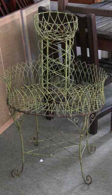 Appraisal: A circular wirework jardini re stand with platform under on