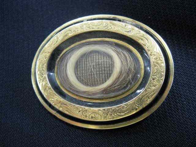 Appraisal: Victorian Gold Mourning Brooch hair inside oval black enameling ''