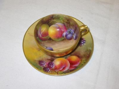 Appraisal: A ROYAL WORCESTER PORCELAIN CUP AND SAUCER painted with fruit