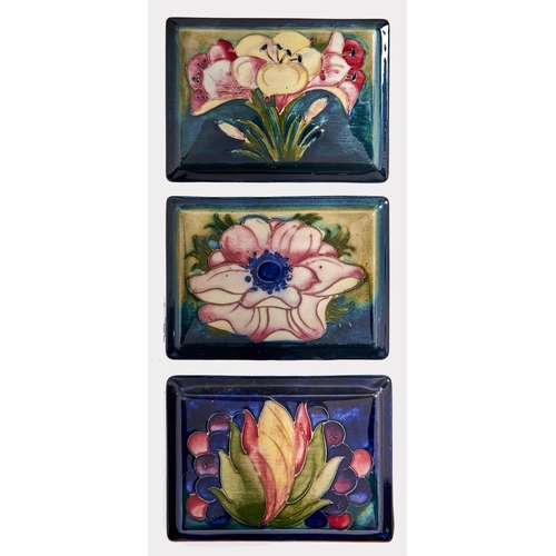 Appraisal: Three Moorcroft leaf and berry and other rectangular box covers