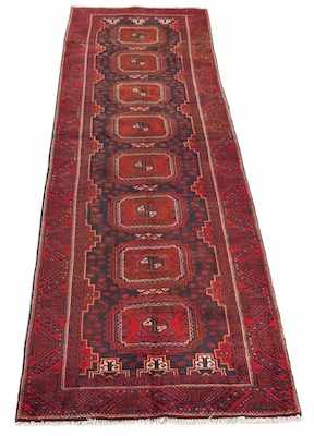 Appraisal: An Antique Kazak Runner Primarily red and blue wool with