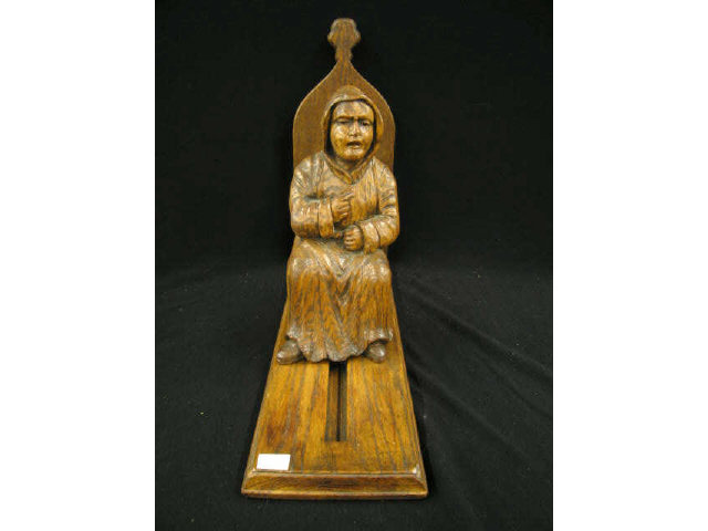 Appraisal: Carved Oak Figural Bookstand sliding seated figure Arts Crafts style