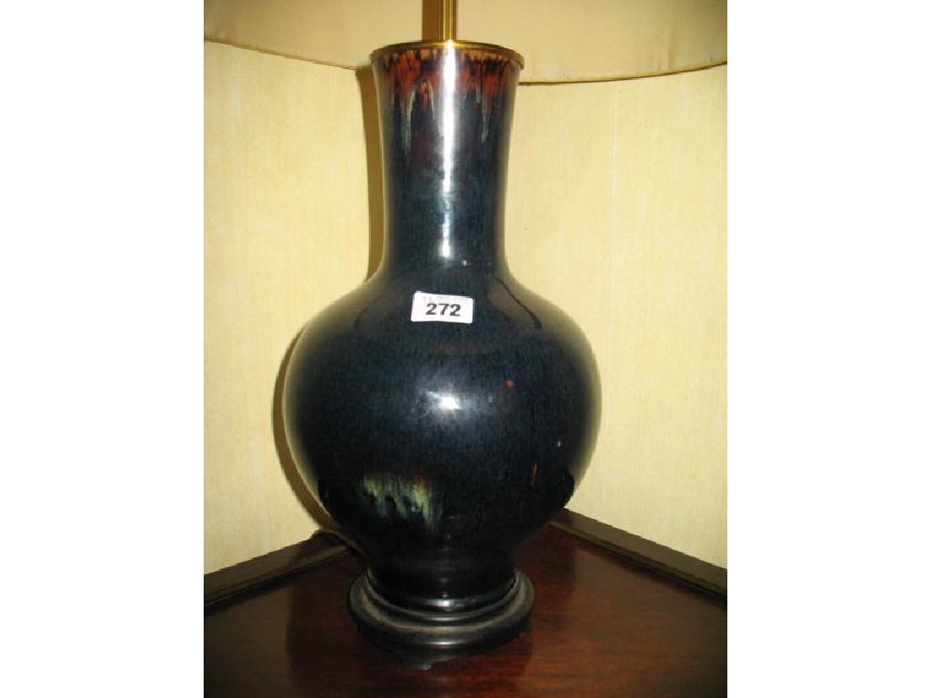 Appraisal: A CHINESE BOTTLE BASE covered in a flambe glaze now