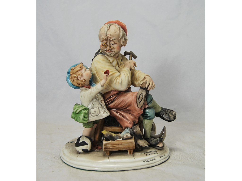 Appraisal: Capo di Monte figure study of shoemaker and child sculptor