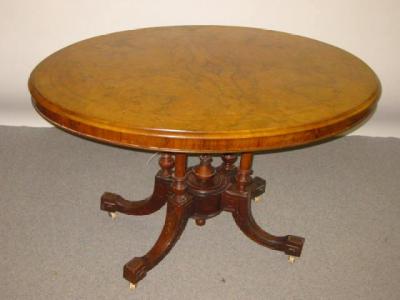 Appraisal: A VICTORIAN WALNUT LOO TABLE the moulded edged quarter veneered