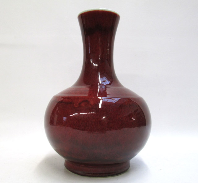 Appraisal: LARGE CHINESE OXBLOOD GLAZED VASE having low shoulder and long